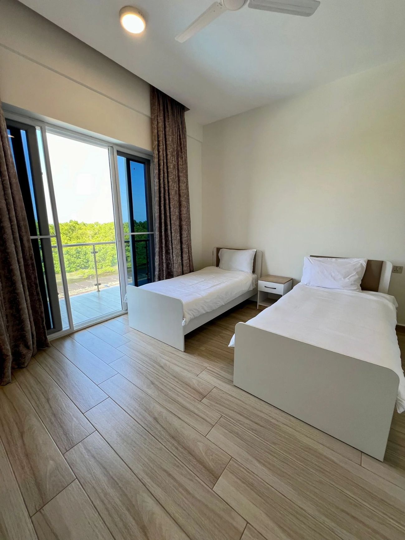 Two-Bedroom Apartment — bedroom with twin beds