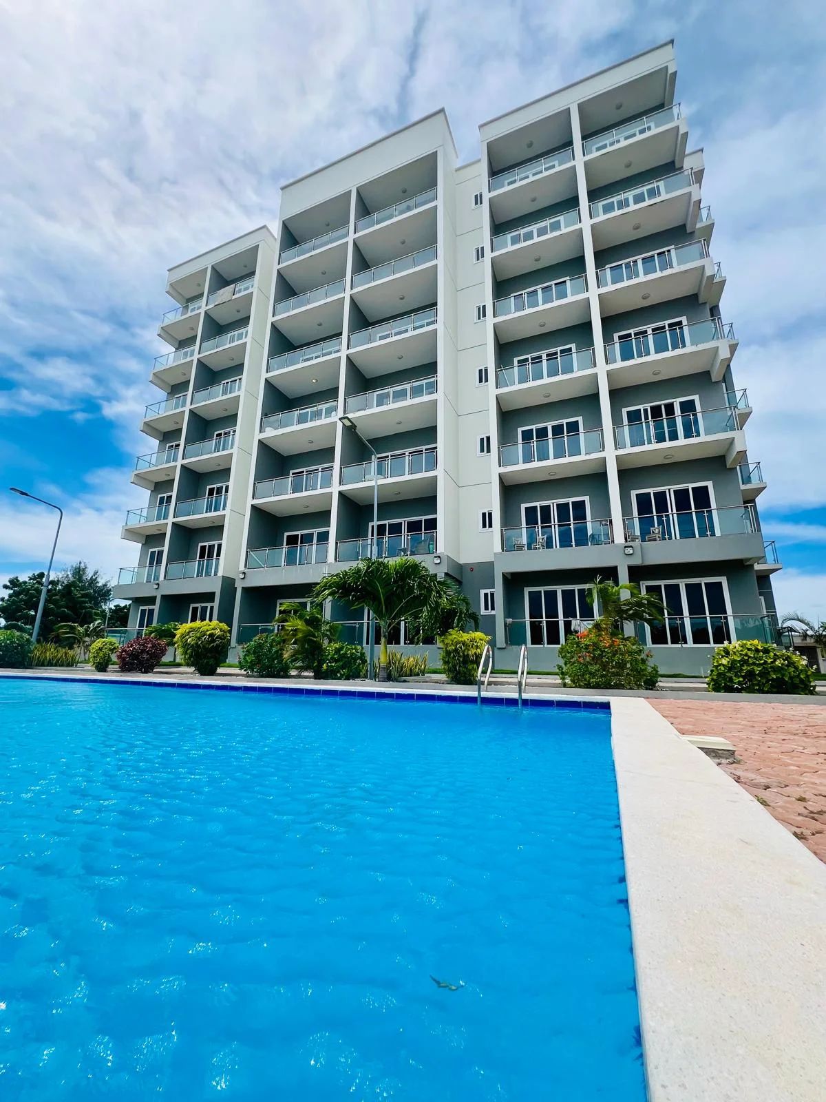 Al-Saadi Apartments — building and swimming pool